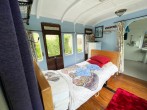 Millpool with single profiling bed looking towards bathroom